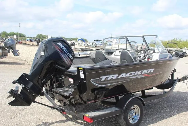 Slide: The Image of 2019 Tracker Pro Guide V-165 WT boat with Mercury engine on trailer. - 4