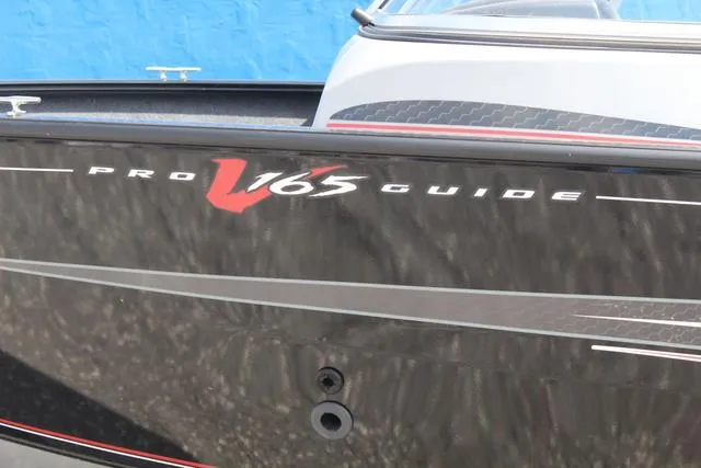 Slide: The Image of 2019 Tracker Pro Guide V-165 WT boat, sleek black exterior with red accents. - 9