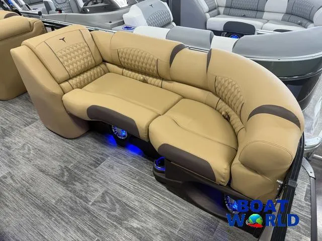 Slide: The Image of Luxurious seating in 2025 Tahoe Cascade 2385 Tritoon boat with elegant design and ambient lighting. - 10