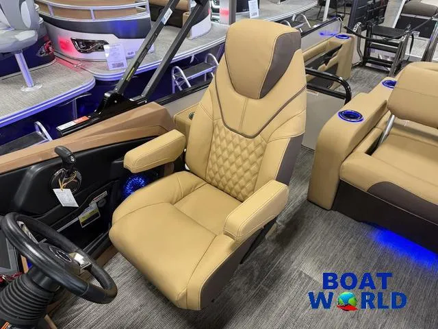 Slide: The Image of 2025 Tahoe Cascade 2385 Tritoon interior with luxurious captain's chair and modern design. - 12