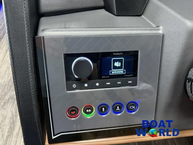 Slide: The Image of Control panel of 2025 Tahoe Cascade 2385 Tritoon with audio system and buttons. - 14
