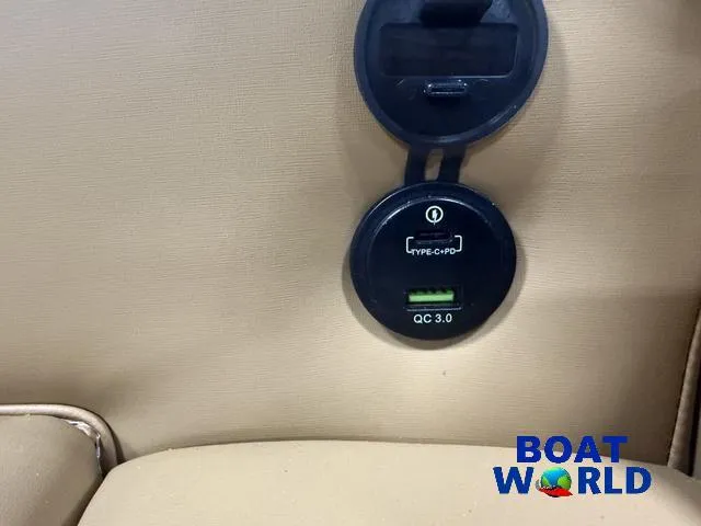 Slide: The Image of USB charging port on 2025 Tahoe Cascade 2385 Swingback Tritoon, featuring Type-C and QC 3.0. - 27