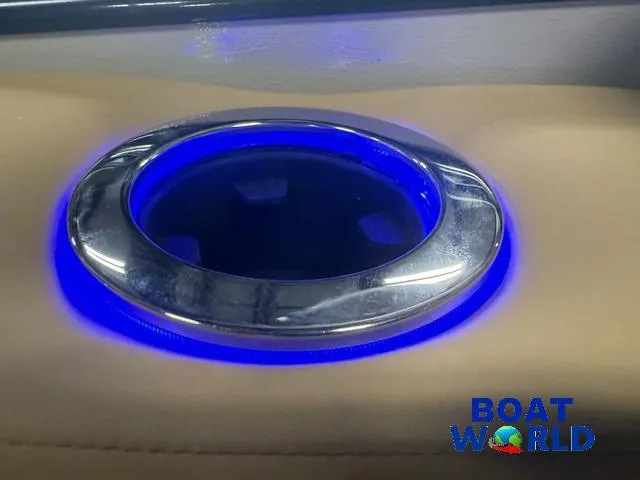 Slide: The Image of Illuminated cup holder on 2025 Tahoe Cascade 2385 Swingback Tritoon boat. - 28