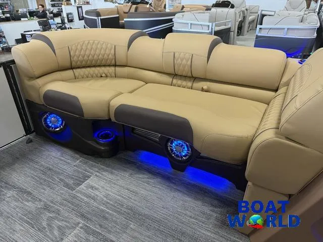 Slide: The Image of Luxurious seating in 2025 Tahoe Cascade 2385 Tritoon with blue LED lighting. - 32