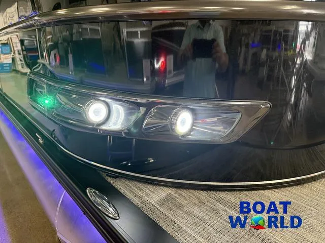 Slide: The Image of 2025 Tahoe Cascade 2385 Tritoon with LED lights at Boat World showroom. - 37