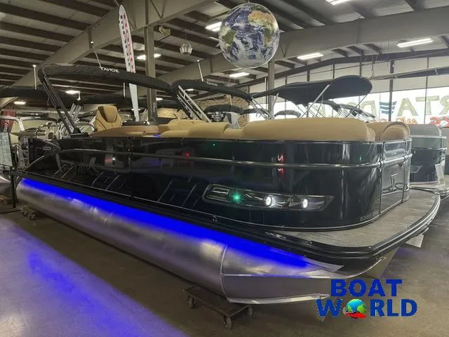 Slide: The Image of 2025 Tahoe Cascade 2385 Swingback Tritoon with Honda engine, showcased indoors at Boat World. - 39
