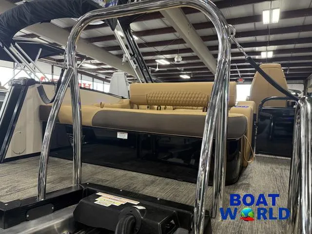 Slide: The Image of 2025 Tahoe Cascade 2385 Swingback Tritoon interior with tan seating, showcased at Boat World. - 44
