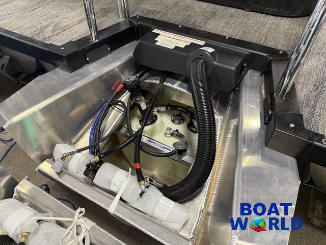 Slide: The Image of 2025 Tahoe Cascade 2385 Tritoon engine compartment with Honda 4-Stroke, showcased by Boat World. - 45