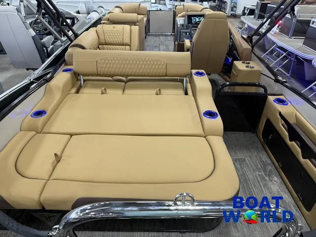 Slide: The Image of 2025 Tahoe Cascade 2385 Swingback Tritoon with luxurious tan seating and modern interior. - 7