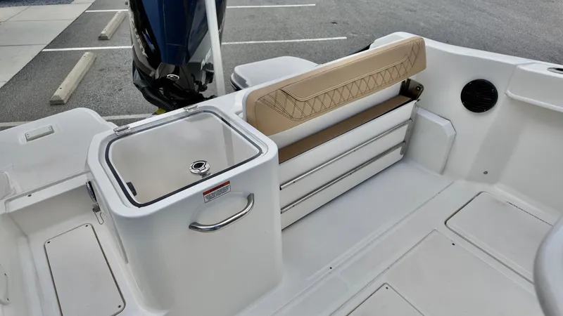 Slide: The Image of 2025 Bayliner Trophy 24 CC boat interior with seating and storage features. - 12