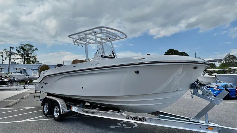 Slide: The Image of 2025 Bayliner Trophy 24 CC boat on trailer under cloudy sky. - 4