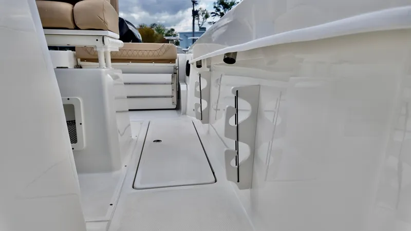 Slide: The Image of 2025 Bayliner Trophy 24 CC boat interior with seating and storage compartments. - 8
