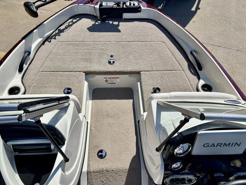 Slide: The Image of 2015 Nitro Sport Boats Z-7 Sport interior with Garmin dashboard and carpeted deck. - 3