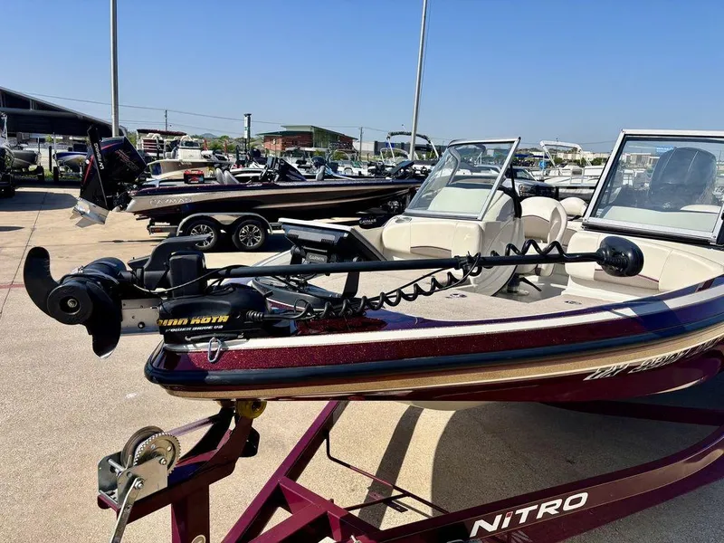 Slide: The Image of 2015 Nitro Sport Boats Z-7 Sport on trailer, equipped with trolling motor, in a boat dealership. - 6