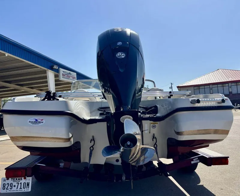 Slide: The Image of 2015 Nitro Sport Boats Z-7 Sport with outboard motor, parked on a trailer. - 7