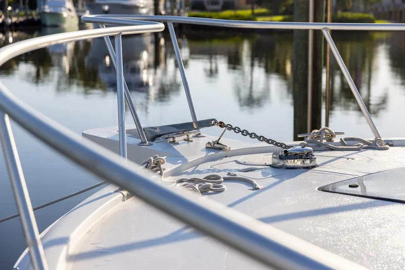 Slide: The Image of Bow of 1997 Luhrs Tournament 320 Open boat with railing and anchor chain. - 19