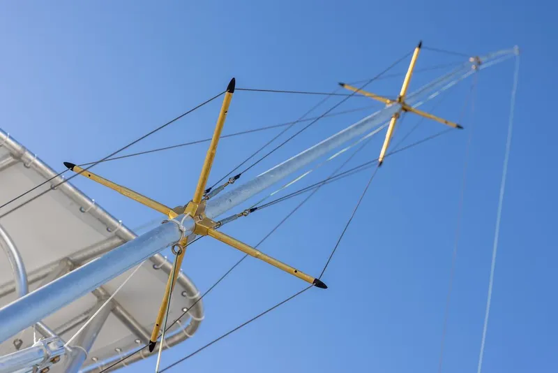 Slide: The Image of Antenna mast of 1997 Luhrs Tournament 320 Open against clear blue sky. - 20