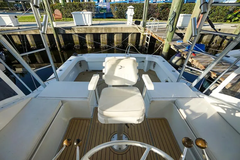 Slide: The Image of 1997 Luhrs Tournament 320 Open boat cockpit with seating and steering wheel. - 29