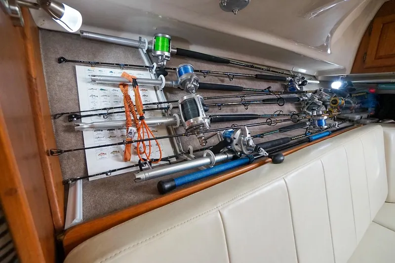 Slide: The Image of Fishing rods stored on a 1997 Luhrs Tournament 320 Open boat interior. - 45