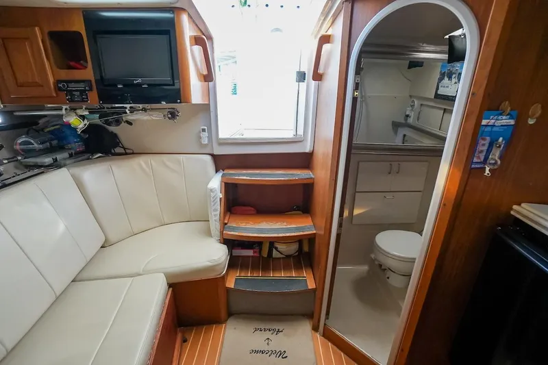 Slide: The Image of Interior of 1997 Luhrs Tournament 320 Open boat with seating and bathroom. - 47