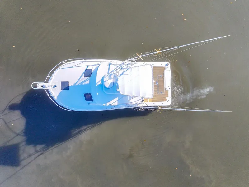 Slide: The Image of Aerial view of 1997 Luhrs Tournament 320 Open boat on calm water. - 7