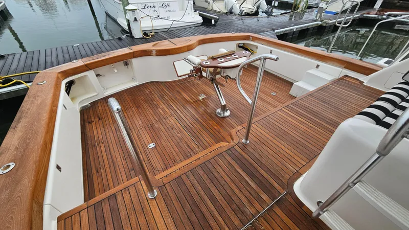 Slide: The Image of 2000 Ocean Yachts 70 Super Sport, teak deck, fishing cockpit, marina setting. - 14