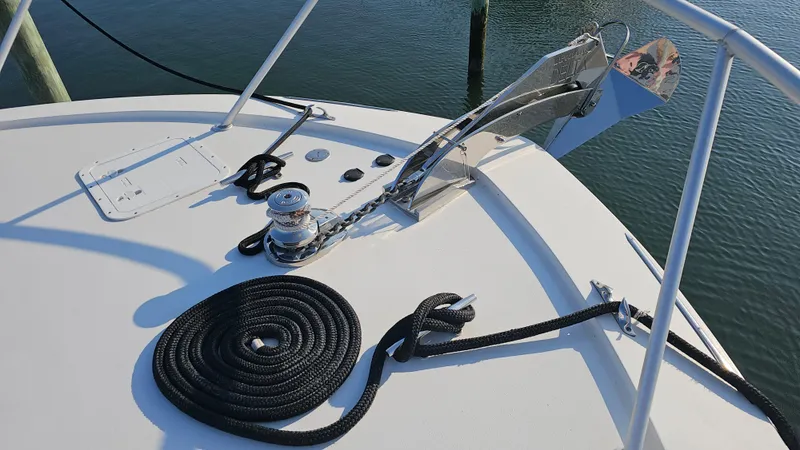 Slide: The Image of Bow of 2000 Ocean Yachts 70 Super Sport with anchor and coiled rope. - 23