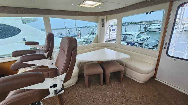 Slide: The Image of Luxurious interior of 2000 Ocean Yachts 70 Super Sport with seating and marina view. - 40