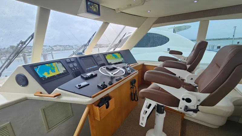 Slide: The Image of Cockpit of 2000 Ocean Yachts 70 Super Sport with navigation screens and leather seats. - 43