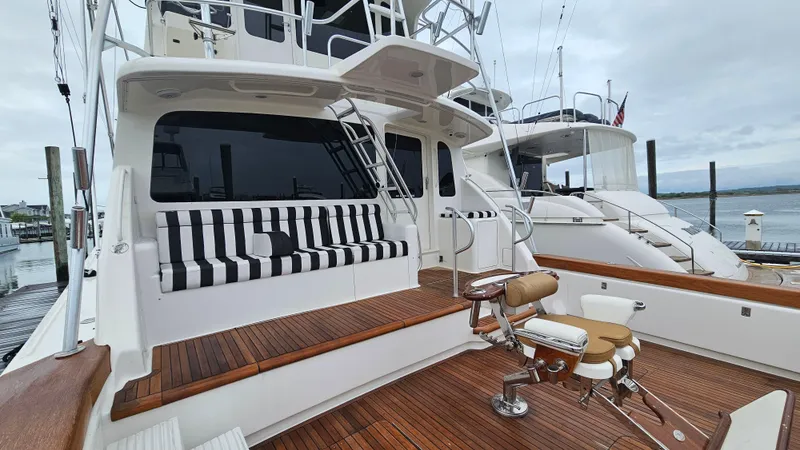 Slide: The Image of Luxurious 2000 Ocean Yachts 70 Super Sport with striped seating and fishing chair. - 7