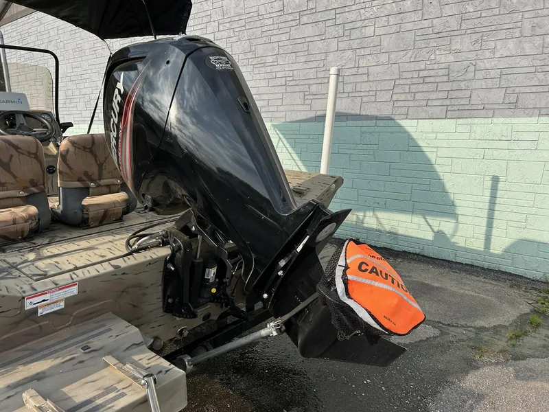 Slide: The Image of 2018 SeaArk 2072 RIVERCAT 200 CC boat with outboard motor and caution cover. - 10