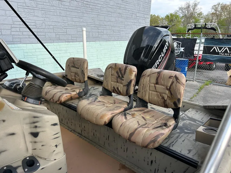 Slide: The Image of 2018 SeaArk 2072 RIVERCAT 200 CC boat with camo seats and Mercury outboard motor. - 6