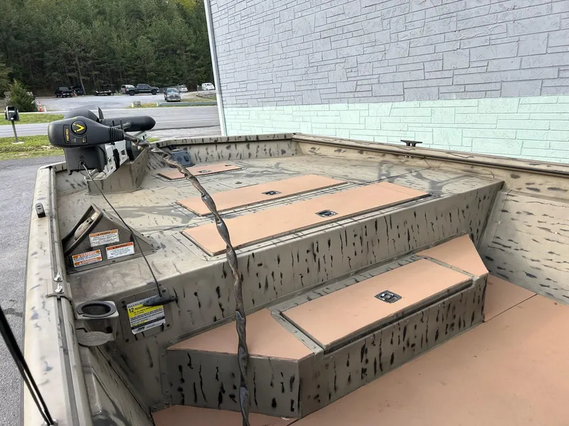 Slide: The Image of 2018 SeaArk 2072 RIVERCAT 200 CC boat with camo design and trolling motor. - 7