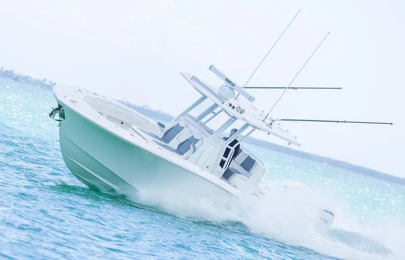 Slide: The Image of 2024 Invincible 33 Open Fisherman boat cruising on open water. - 13