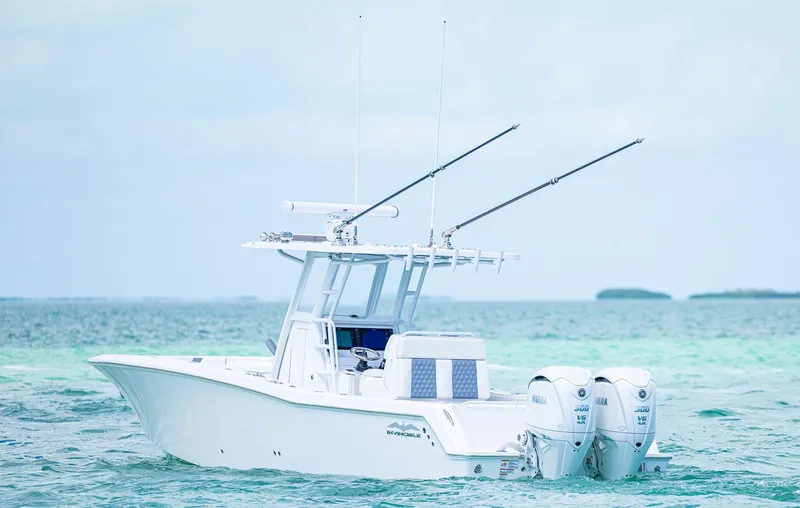 Slide: The Image of 2024 Invincible 33 Open Fisherman boat on turquoise ocean waters. - 22