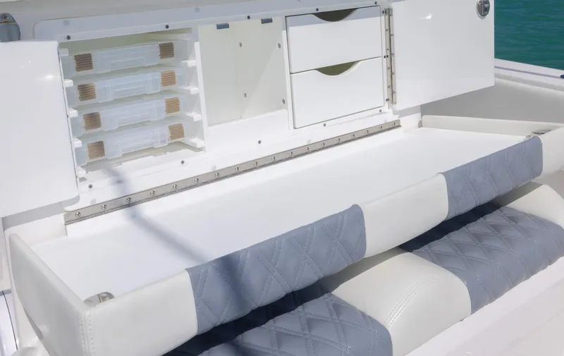 Slide: The Image of 2024 Invincible 33 Open Fisherman boat storage and seating area. - 39