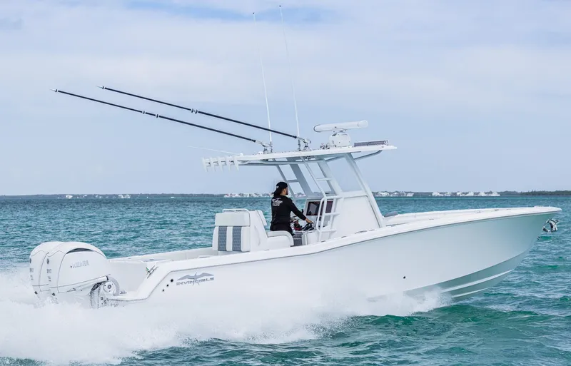 Slide: The Image of 2024 Invincible 33 Open Fisherman boat cruising on open water. - 4