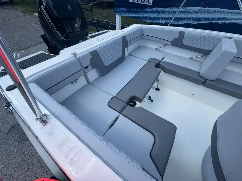 Slide: The Image of 2025 Bayliner VR4 Bowrider OB interior with gray seating and spacious layout. - 5