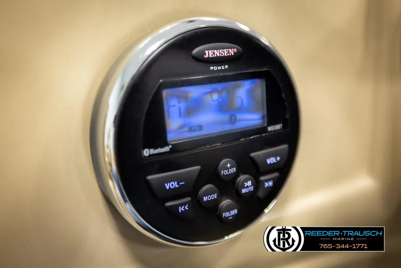 Slide: The Image of Jensen audio system on 2016 Lowe SS230 boat dashboard, featuring Bluetooth connectivity. - 28