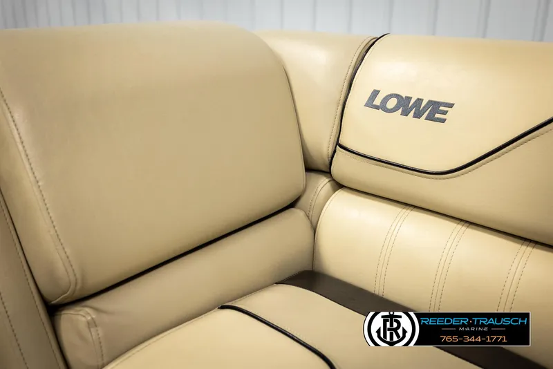 Slide: The Image of Beige leather seating on 2016 Lowe SS230 boat, featuring logo and stitching details. - 35