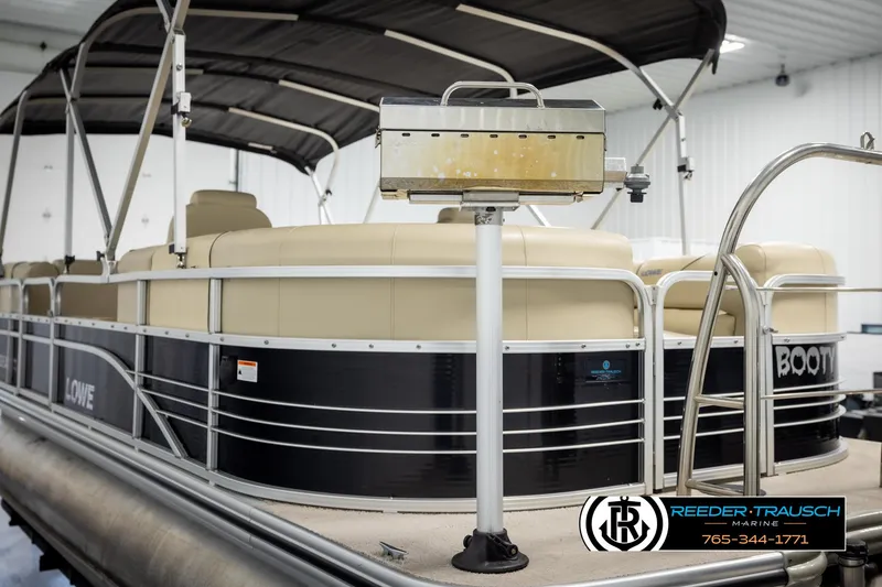 Slide: The Image of 2016 Lowe SS230 pontoon boat with canopy in indoor storage. - 41
