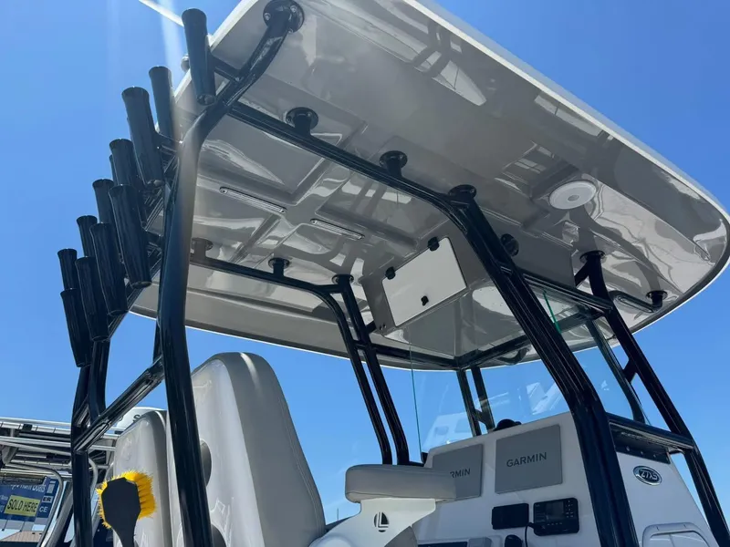 Slide: The Image of 2022 Cape Horn 27 XS boat with T-top and rod holders, viewed from the rear. - 14