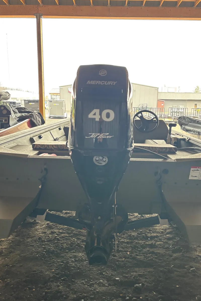 Slide: The Image of 2025 Lowe Roughneck 1860 boat with Mercury 40 HP outboard motor, rear view. - 4