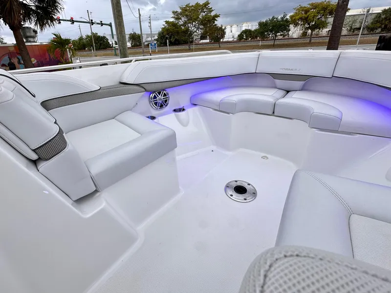Slide: The Image of 2021 Formula 270 Bowrider interior with white seating and blue LED lighting. - 11
