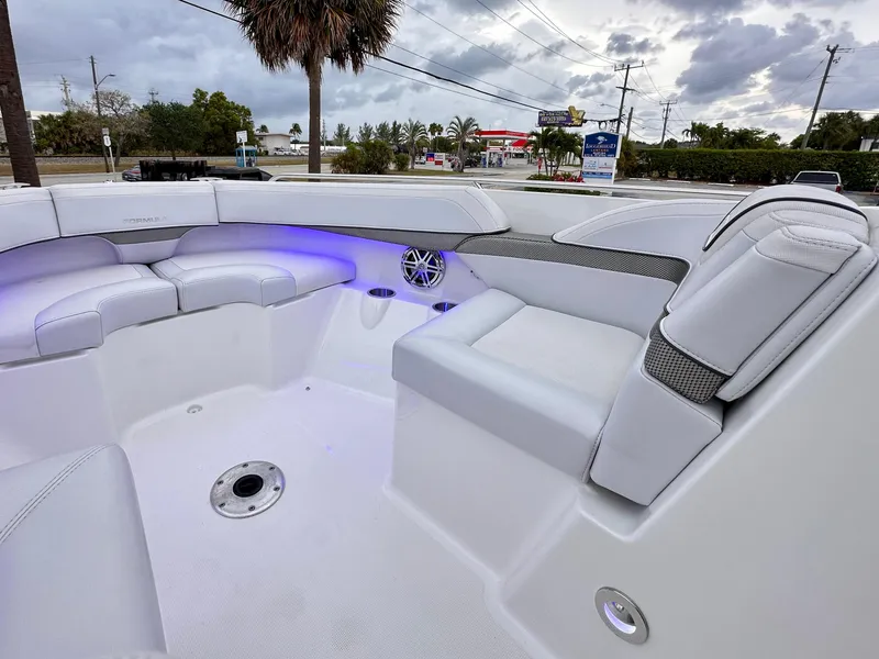 Slide: The Image of 2021 Formula 270 Bowrider interior with white seating and ambient lighting. - 12