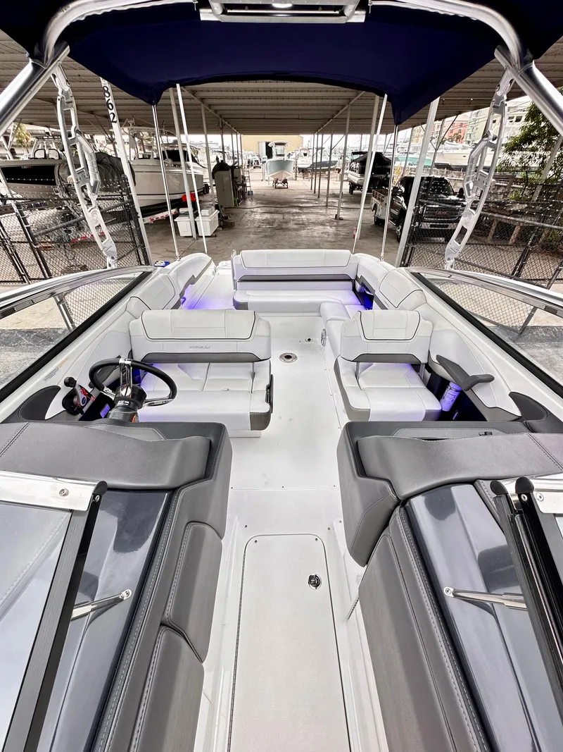 Slide: The Image of 2021 Formula 270 Bowrider with spacious seating and modern design under a canopy. - 13