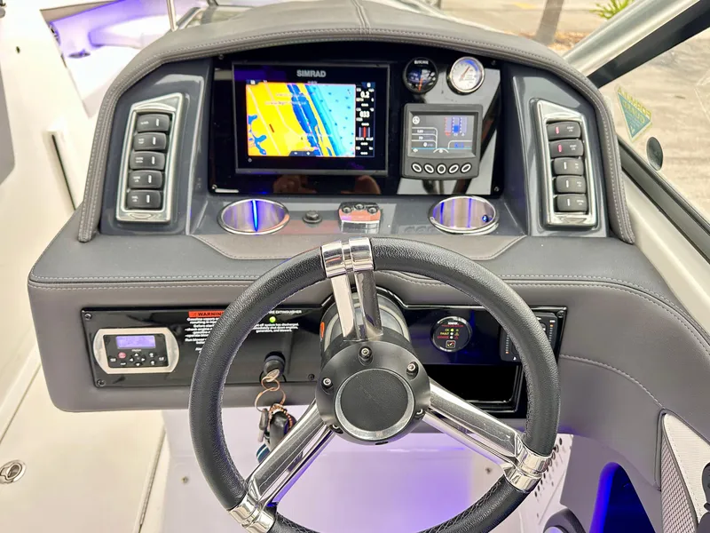 Slide: The Image of Dashboard of 2021 Formula 270 Bowrider with navigation display and controls. - 15