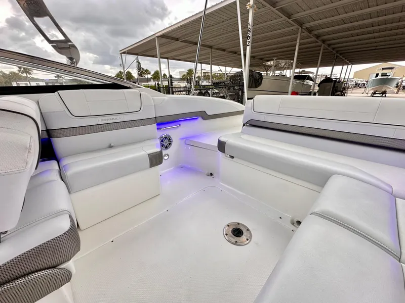 Slide: The Image of 2021 Formula 270 Bowrider interior with spacious seating and ambient lighting. - 18