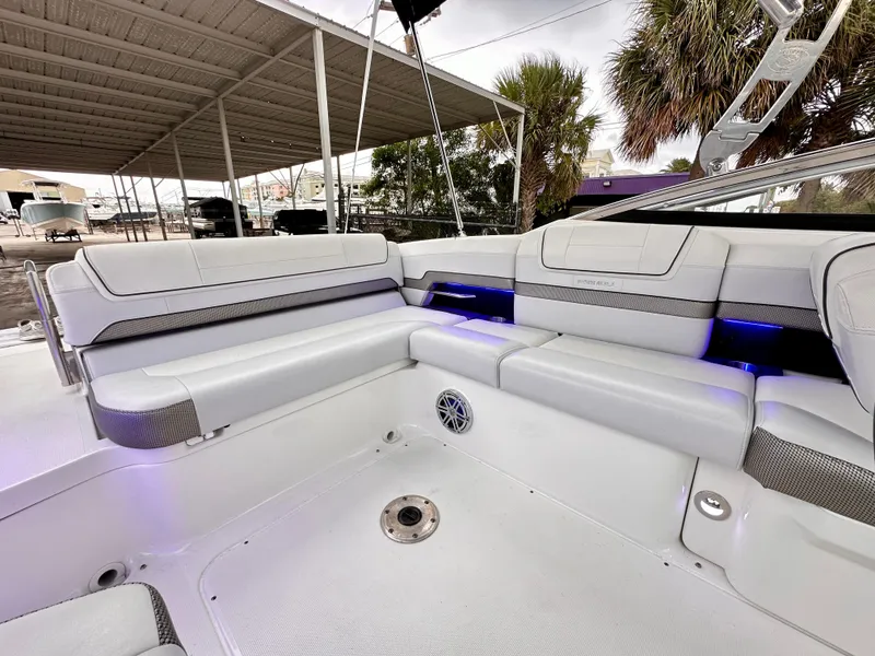 Slide: The Image of 2021 Formula 270 Bowrider interior with white seating and blue accent lighting. - 19