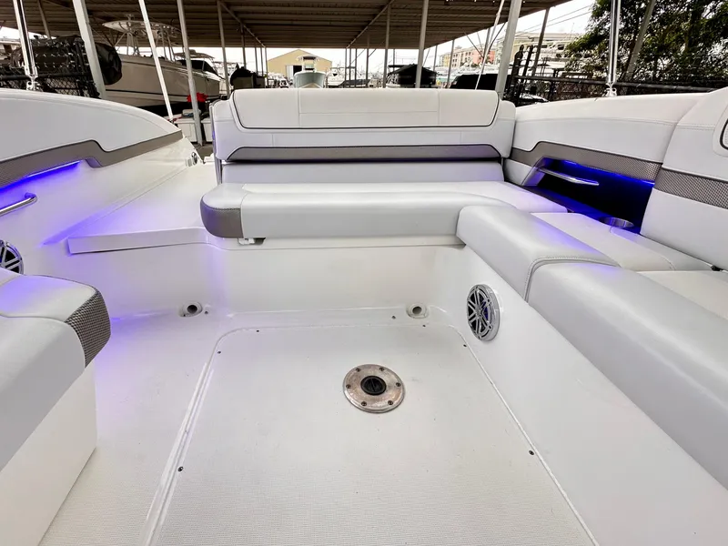 Slide: The Image of 2021 Formula 270 Bowrider interior with white seating and blue accent lighting. - 20